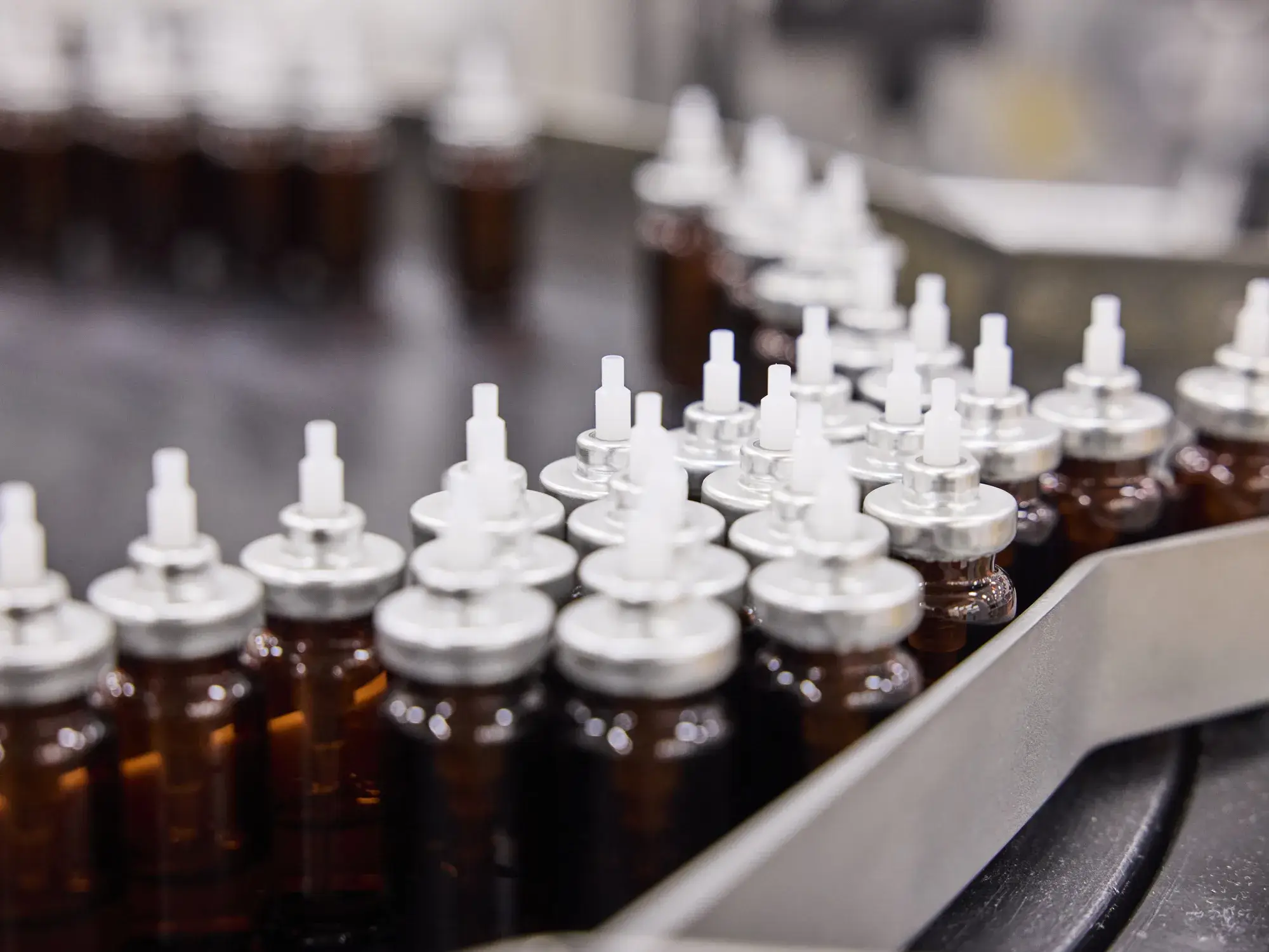 A row of bottles on a conveyor belt